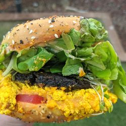 The Cosmic Kitchen - Breakfast sandwich on a North Shore Bagel Co bagel. photo: @mandolindavis