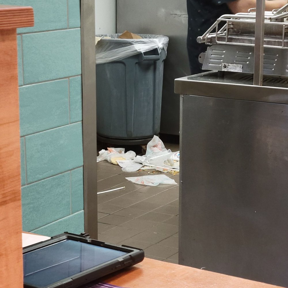 Taco Bell - There's a photo including trash in the kitchen area. There was food all over the floor previously but the trash was left upon the floor. - Tacos Near Me - Ebensburg, Pennsylvania Taco Bell - There's a photo including trash in the kitchen area. There was food all over the floor previously but the trash was left upon the floor. - Tacos Near Me - Ebensburg, Pennsylvania