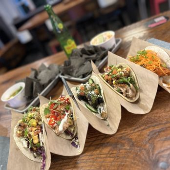 Velvet Taco - a row of tacos on a table - Tacos Near Me - Houston, Texas Velvet Taco - a row of tacos on a table - Tacos Near Me - Houston, Texas