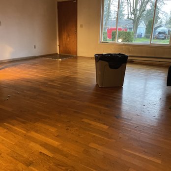 Expert Hardwood Floors - Before, during demo. Some odd staining visible, likely an acid of some kind that dripped on the floor by prior owner/tenants. - Flooring Near Me - Tacoma, Washington Expert Hardwood Floors - Before, during demo. Some odd staining visible, likely an acid of some kind that dripped on the floor by prior owner/tenants. - Flooring Near Me - Tacoma, Washington