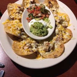 El Tio - Chicken nachos, $10.95. Lotta price, not a lotta nacho. Incomplete cheese melt. Served cold.