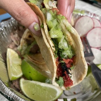 El Rey Del Taco To Go - a hand holding a taco - Mexican Near Me - Astoria, New York El Rey Del Taco To Go - a hand holding a taco - Mexican Near Me - Astoria, New York