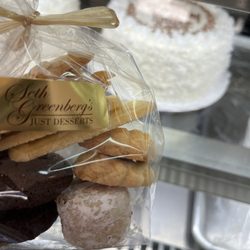 Seth Greenberg's Just Desserts - Selected cookies with coconut and cream cake in background