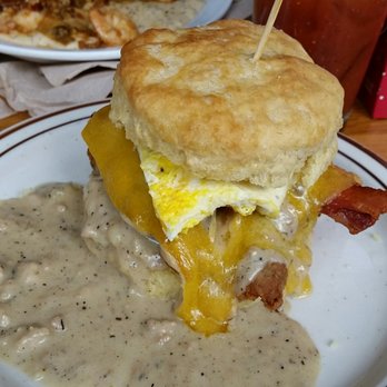 Pine State Biscuits - The Reggie Deluxe. Pictured in back: Shrimp and Grits - Breakfast & Brunch Near Me - Portland, Oregon