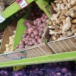 LA Mart - Onions potatoss and ginger shelf.