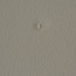 This is a hold that pushed out from the wall where my TV is located from the technician drilling down from the attic