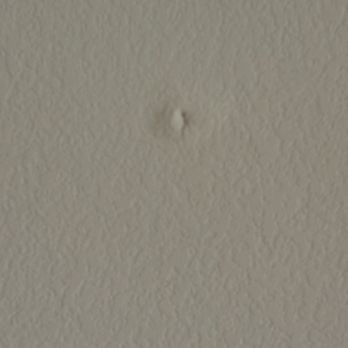 Ezee Fiber - This is a hold that pushed out from the wall where my TV is located from the technician drilling down from the attic - Internet Service Providers Near Me - Houston, Texas
