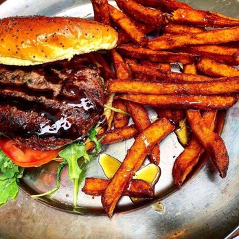 Eureka! - 28 Day Dry-Aged Burger with Sweet Potato Fries drizzled with honey. - Bars Near Me - Cerritos, California Eureka! - 28 Day Dry-Aged Burger with Sweet Potato Fries drizzled with honey. - Bars Near Me - Cerritos, California