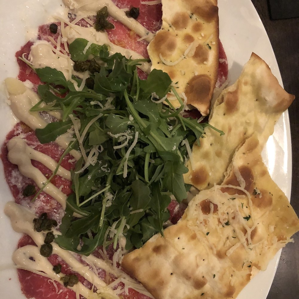 Bottles & Bones - OK this was my favorite, beef carpaccio prepared perfectly - Bars Near Me - Suwanee, Georgia