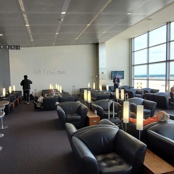 Lufthansa Lounge - a man working on his laptop - Airport Lounges Near Me - Dulles, Virginia