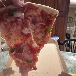 Lafamilia - See through dough saturated in sauce (canned) with little cheese. A piece of mush.