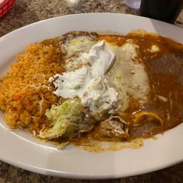 Cheese enchilada and a chili relleno with a side of rice and beans . Cheese enchilada and a chili relleno with a side of rice and beans .