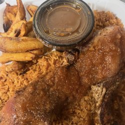 Asanka Delight - Jollof rice, plantains, savory tomato based sauce, and baked chicken