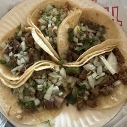 Starting bottom left going clockwise: lengua, cabeza, chicken, asada, tripe Starting bottom left going clockwise: lengua, cabeza, chicken, asada, tripe