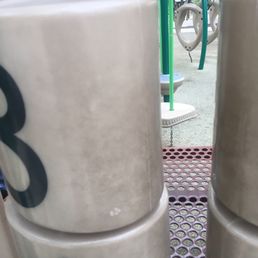 Kids play area play surfaces black with dirt
