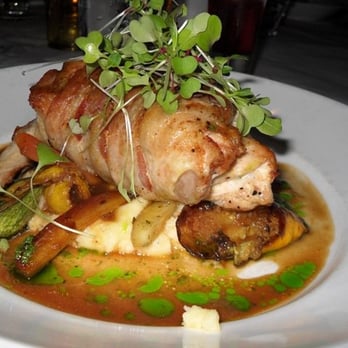 Carnivale Chicago - 1/2 chicken stuffed w/ machengo cheese wrapped in bacon on a bed of mashed potatoes. - Latin American Near Me - Chicago, Illinois Carnivale Chicago - 1/2 chicken stuffed w/ machengo cheese wrapped in bacon on a bed of mashed potatoes. - Latin American Near Me - Chicago, Illinois