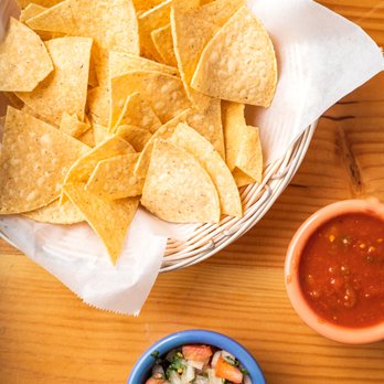 Tequila Sunrise - a basket of tortilla chips and a bowl of salsa - Mexican Near Me - Larchmont, New York Tequila Sunrise - a basket of tortilla chips and a bowl of salsa - Mexican Near Me - Larchmont, New York