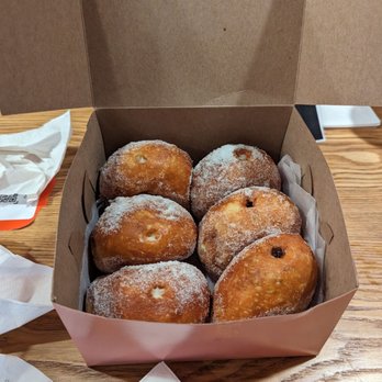 Leonard's Bakery - Malasada puffs: custard, macadamia nut, dobash (chocolate), haupia (coconut) - Bakeries Near Me - Honolulu, Hawaii Leonard's Bakery - Malasada puffs: custard, macadamia nut, dobash (chocolate), haupia (coconut) - Bakeries Near Me - Honolulu, Hawaii