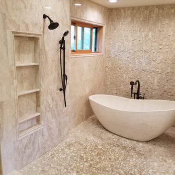 Ron The Tile Guy - Polished marble on the walls with a stacked stone accent wall and river-rock base. - Tiling Near Me - Madison, Wisconsin Ron The Tile Guy - Polished marble on the walls with a stacked stone accent wall and river-rock base. - Tiling Near Me - Madison, Wisconsin
