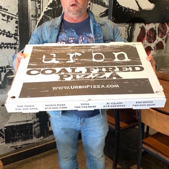 URBN - Hubby holding our pizza. - Pizza Near Me - Vista, California