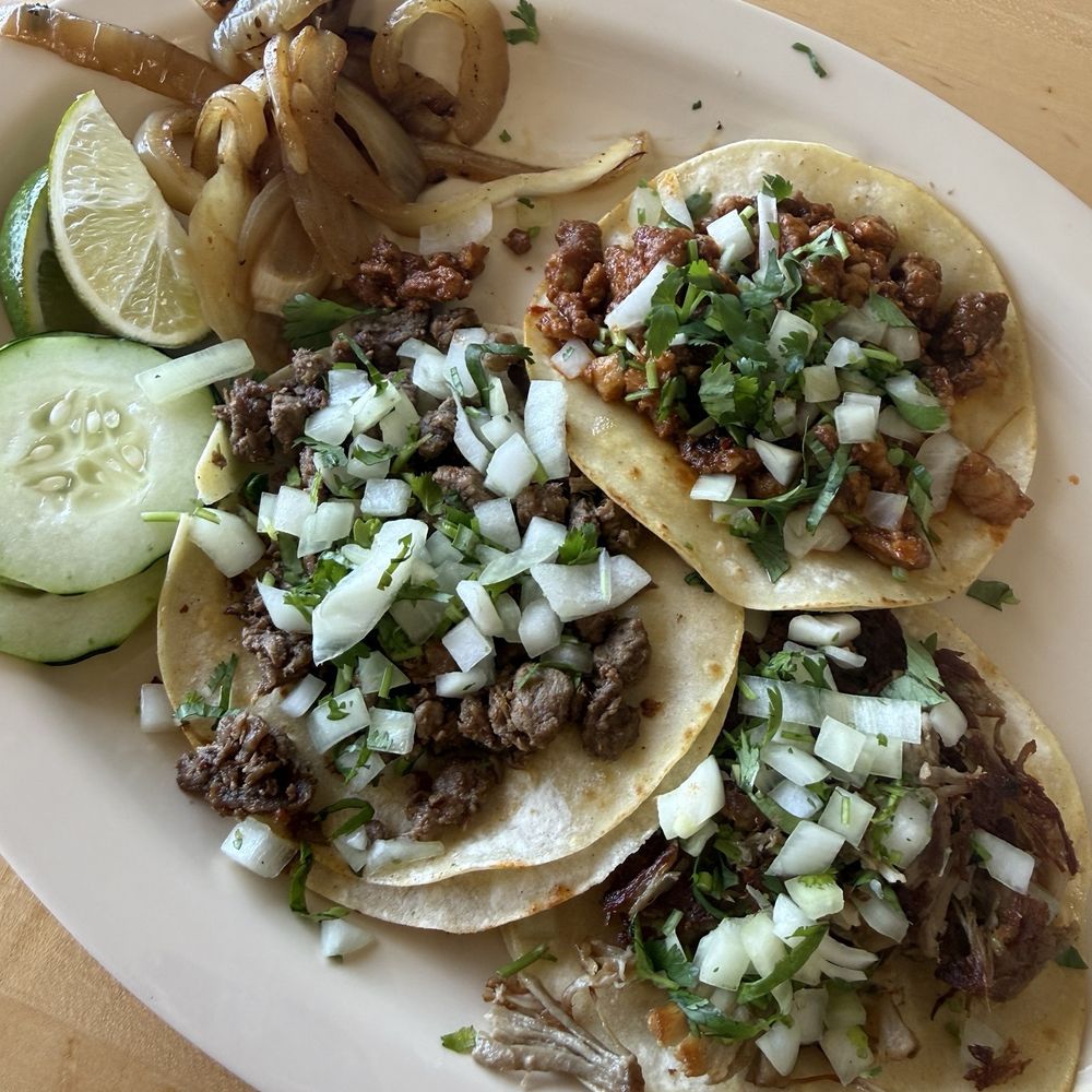 Al pastor, carnitas, and asada tacos Al pastor, carnitas, and asada tacos