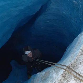 Exit Glacier Guides - Calvin drops into the Exit Glacier - Climbing Near Me - Seward, Alaska