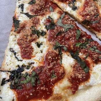 Pino’s Pizza - Close up of Margarita slice - Pizza Near Me - Deer Park, New York Pino’s Pizza - Close up of Margarita slice - Pizza Near Me - Deer Park, New York