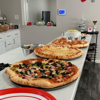 Big T's Pizza - three pizzas on a counter - Pizza Near Me - Rialto, California Big T's Pizza - three pizzas on a counter - Pizza Near Me - Rialto, California