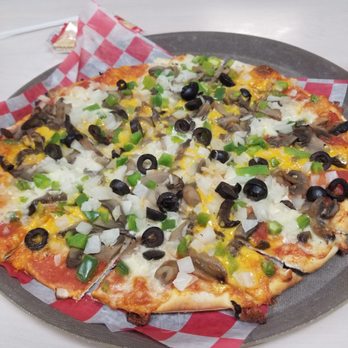 Davis Bros Pizza Inc - a pizza on a tray - Pizza Near Me - East Peoria, Illinois
