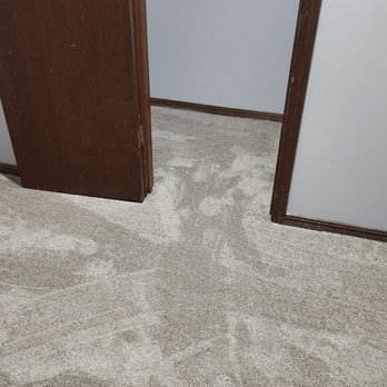 Precision Flooring - a carpeted room with a closet - Flooring Near Me