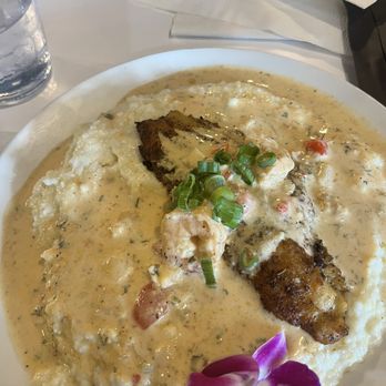 B Sweet Bistro - Fish and grits swimming in creole sauce. I wish I would have taken a pic of what I left on the plate. Which was 80% of the for. - Food Court Near Me - New Orleans, Louisiana