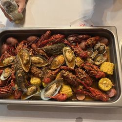 Crab & Shell Cajun Seafood - Crawfish, green mussels, sausage, clams, corn and Hush Puppies