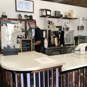 Muse Coffee Studio - a man working behind the counter - Coffee & Tea Near Me - Chicago, Illinois
