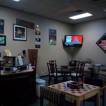 The Leaf - a living room with chairs, a table, and a television - Coffee & Tea Near Me - Abilene, Texas The Leaf - a living room with chairs, a table, and a television - Coffee & Tea Near Me - Abilene, Texas