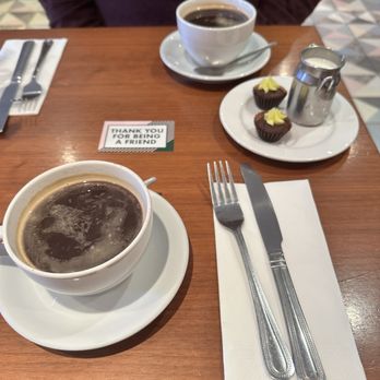 The Bakehouse - Two Americano's with the cute little milk can for the cream and two brownie bites that were complementary - Bakeries Near Me - Dublin, D