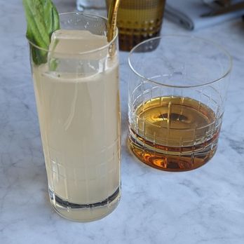 Wren - One of their vodka based cocktails and whiskey - Cocktail Bars Near Me - Tysons, Virginia