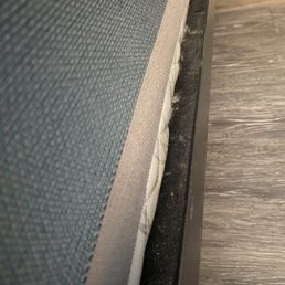 Dust & dirt covers the bed railings. No bed skirt on beds, box springs exposed. Dust & dirt covers the bed railings. No bed skirt on beds, box springs exposed.