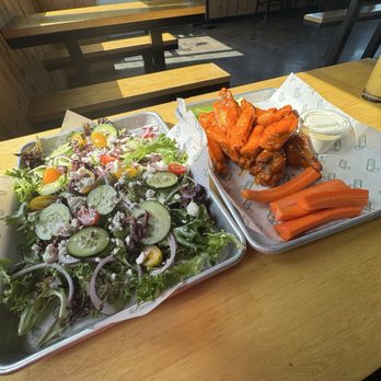 Green Cheek Beer Co. - Buffalo Chicken Wings and Mediterranean Salad - Breweries Near Me - Sunset Beach, California Green Cheek Beer Co. - Buffalo Chicken Wings and Mediterranean Salad - Breweries Near Me - Sunset Beach, California