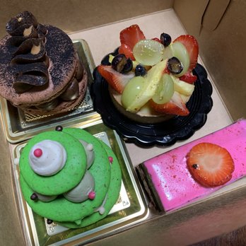 Cannelle - Clockwise from top left: Chocolate Hazelnut Macaron, Mixed Fruit Tart,  Chocolate Strawberry, Pistachio Macaron Christmas Tree - Coffee & Tea Near Me - Ann Arbor, Michigan