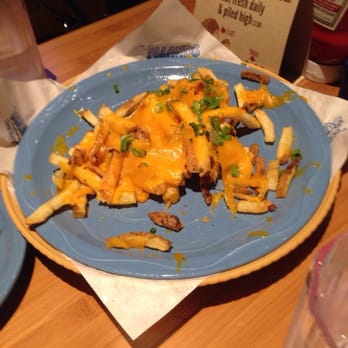 Islands Restaurant - Just some of our cheddar fries! A must get! - Sports Bars Near Me - Irvine, California