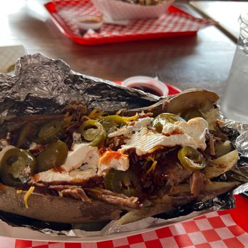 Porky's Belly BBQ - Loaded chopped brisket baked potato with all the fixins - Barbeque Near Me - Montgomery, Texas Porky's Belly BBQ - Loaded chopped brisket baked potato with all the fixins - Barbeque Near Me - Montgomery, Texas