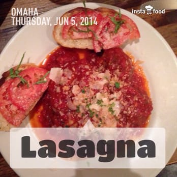 Nicola's - There is lasagne Mediterranean plus 2 meatballs under this sauce. - Italian Near Me - Omaha, Nebraska