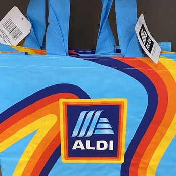 ALDI - a blue shopping bag with a colorful design - Grocery Near Me - Brockton, Massachusetts
