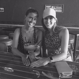 two women sitting at a table two women sitting at a table