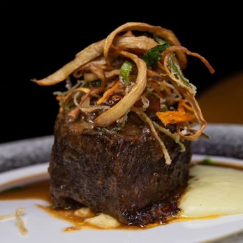 Xperience - a piece of steak on a plate - Cocktail Bars Near Me - Woodbridge, New Jersey