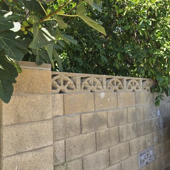 Richard Construction - Repair of back yard wall viewed from alley - Masonry/Concrete Near Me