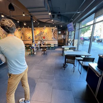 Shake Shack Harlem - a man playing a game of bowling - Fast Food Near Me - New York, New York Shake Shack Harlem - a man playing a game of bowling - Fast Food Near Me - New York, New York