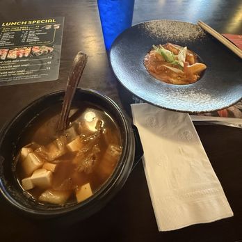 Sun Izakaya - Tofu and kimchi soup on the left. Cheesy spicy ttekbokki (rice cake noodles) on the right. - Asian Fusion Near Me - Vicksburg, Mississippi Sun Izakaya - Tofu and kimchi soup on the left. Cheesy spicy ttekbokki (rice cake noodles) on the right. - Asian Fusion Near Me - Vicksburg, Mississippi
