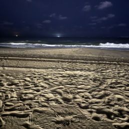 The beach in front of the motel at night. The beach in front of the motel at night.