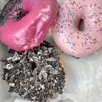 Voodoo Doughnut - three different flavored donuts in a box - Donuts Near Me - Katy, Texas